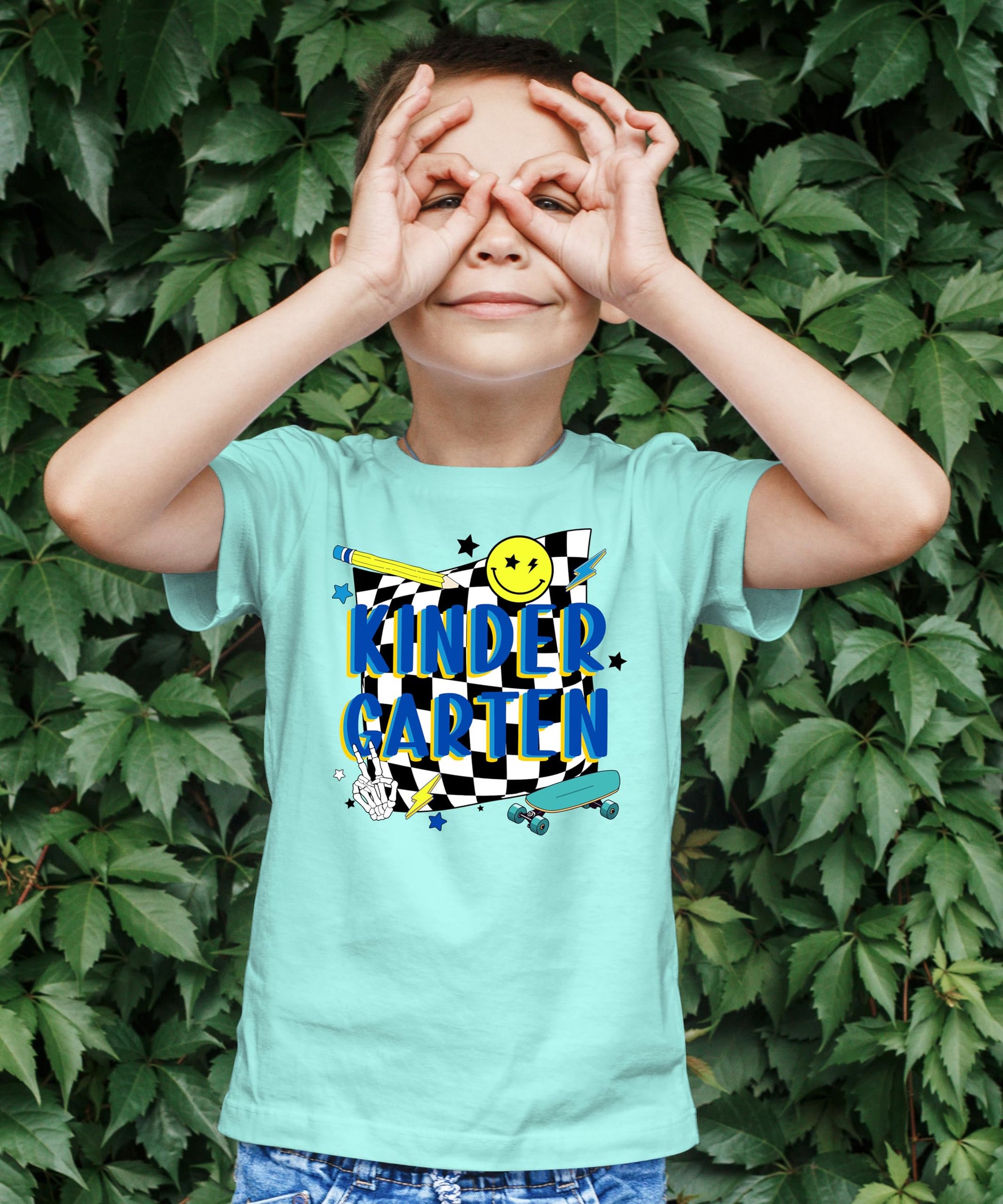 Flat lay of retro kindergarten skateboard t-shirt for boys, first day of school style