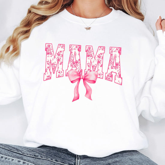 Flat lay of black MAMA sweatshirt with pink bow graphic detail