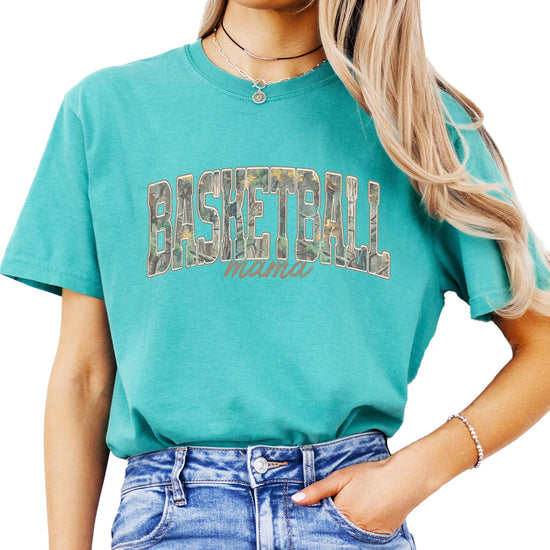 Close-up of distressed camo Basketball Mama print on adult graphic tee