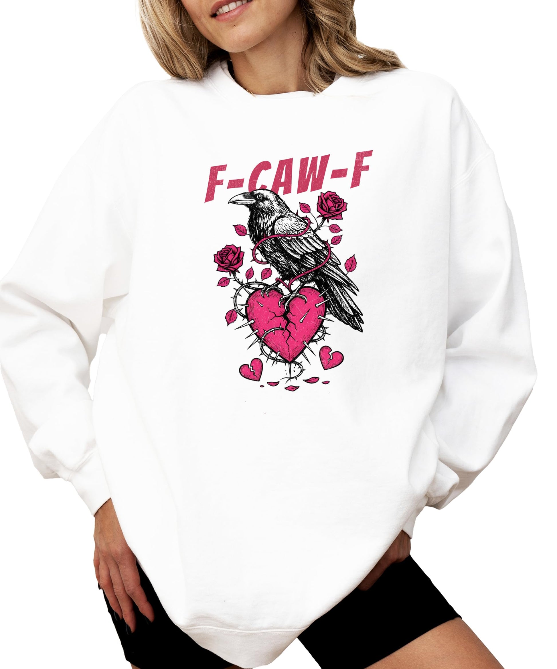 Detail shot of crow broken heart sweatshirt print quality on white fleece fabric