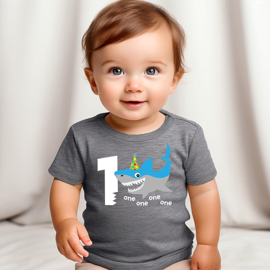 Baby boy shark 1st birthday shirt styled with party decorations