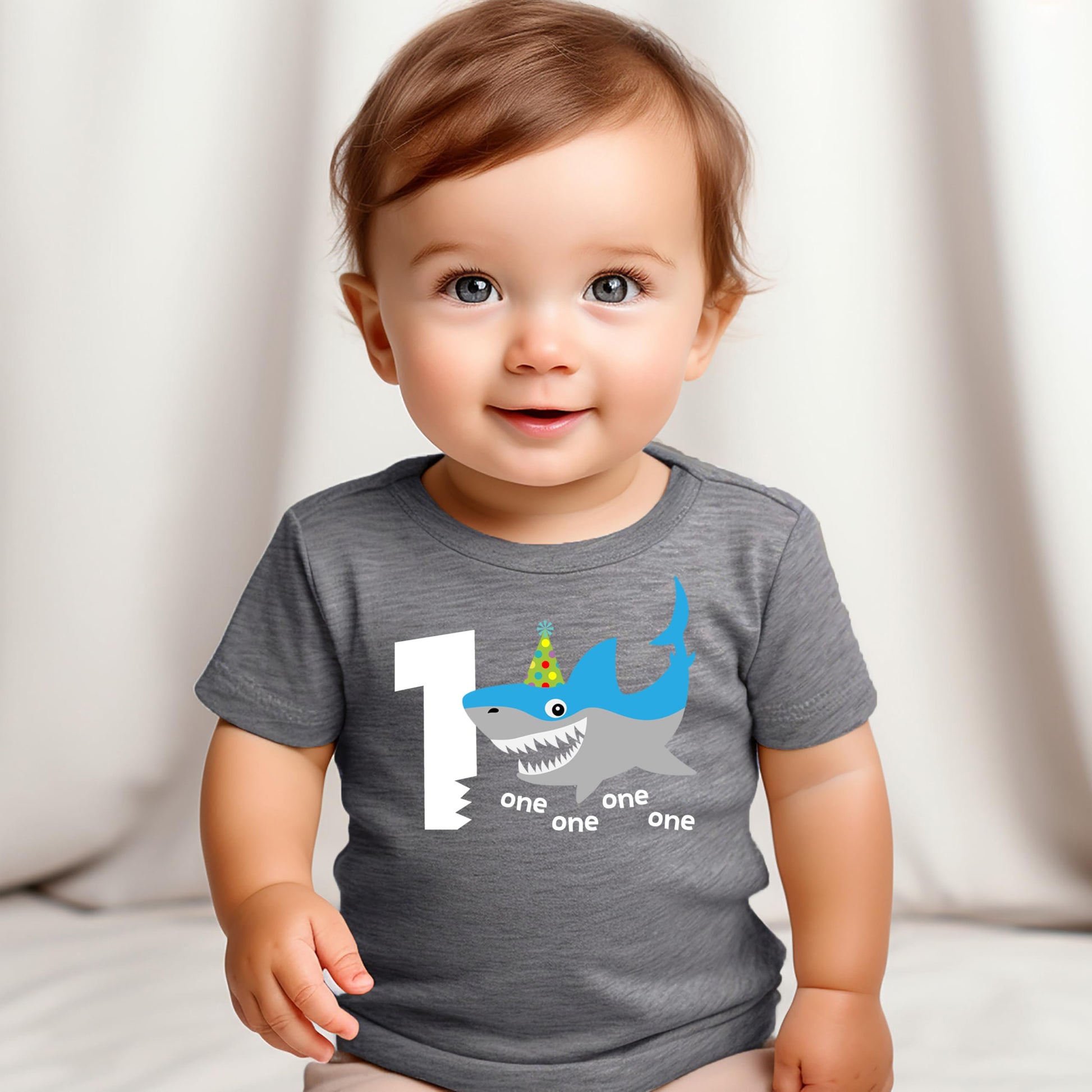 Baby boy shark 1st birthday shirt styled with party decorations
