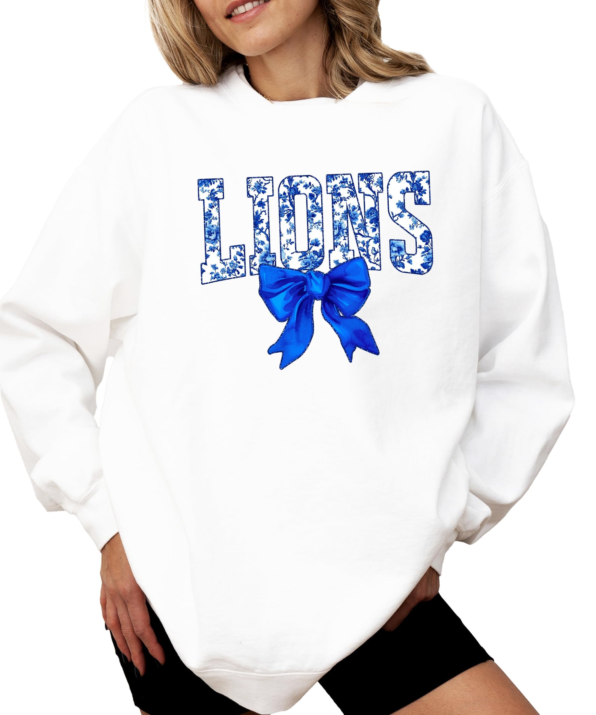 Women's blue floral Lions graphic sweatshirt with coquette bow detail on black fabric