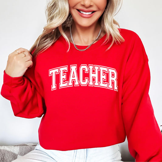Close-up view of Teacher varsity letters print on red Valentine's sweatshirt