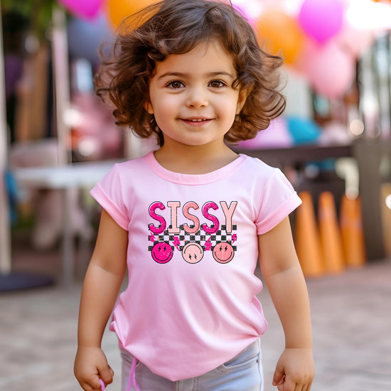Close-up of retro-style Sissy graphic print on pink kids tee by Olive Loves Apple