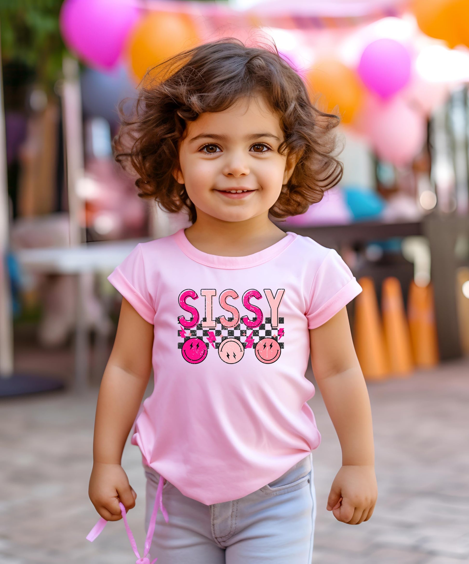 Close-up of retro-style Sissy graphic print on pink kids tee by Olive Loves Apple