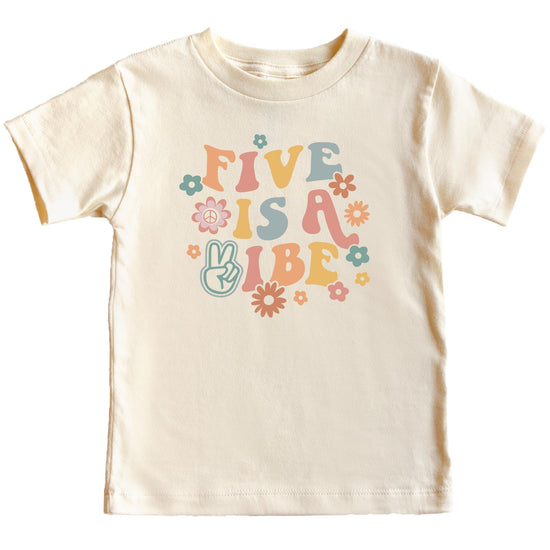 Five is a Vibe girls birthday shirt laid flat showing full retro graphic design with colorful flowers