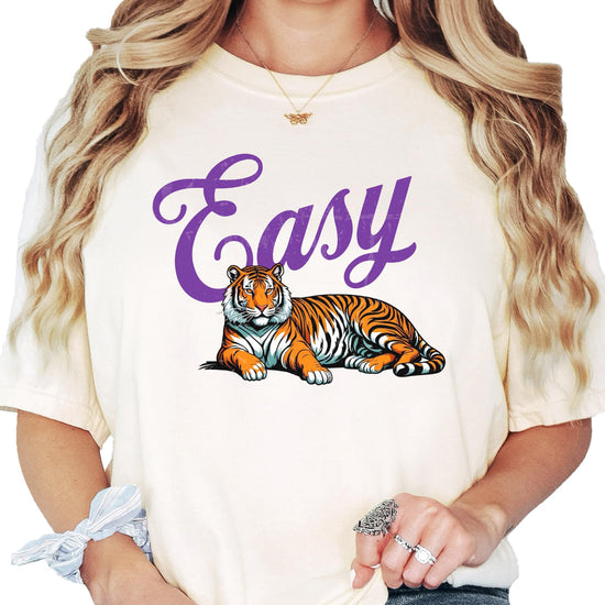 Close-up of Easy Tiger graphic tee showing purple text and tiger illustration on soft ivory fabric