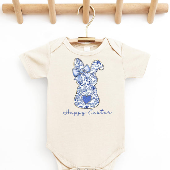 Detail shot of Happy Easter script and floral bunny silhouette on peach baby bodysuit