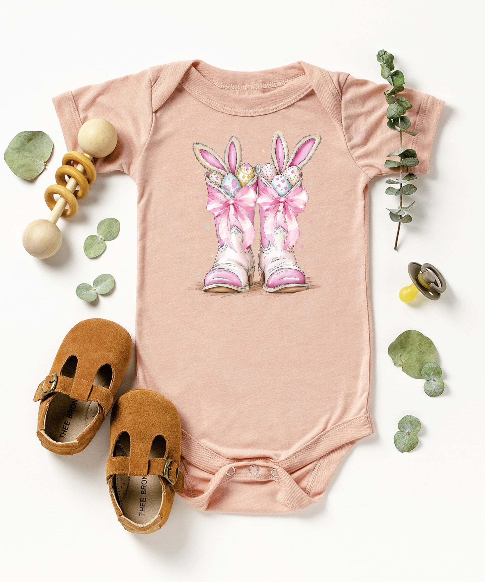 Full product shot of pink western Easter baby bodysuit for girls newborn to 12 months