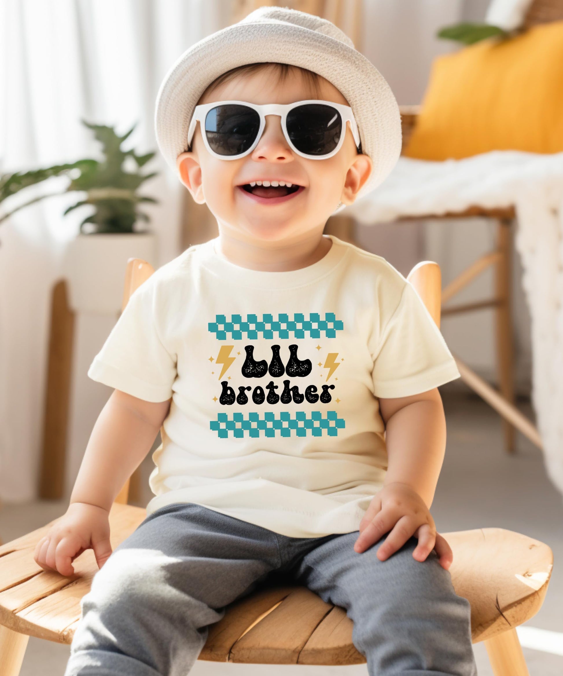 Little brother shirt and bodysuit flat lay for sibling reveal baby announcement