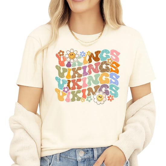 Vikings team spirit shirt flat lay displaying full groovy rainbow letter design