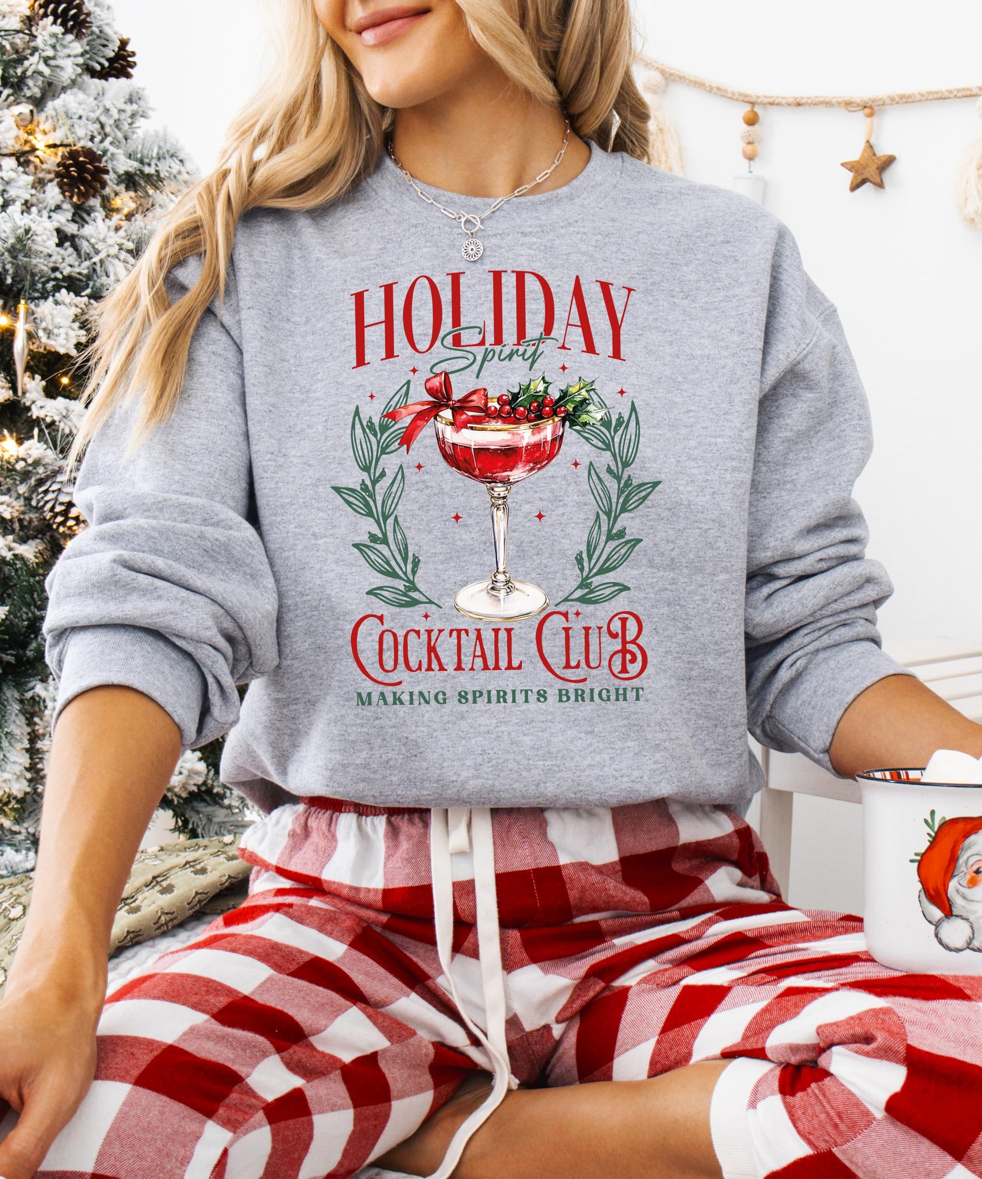 Front view of gray Holiday Spirit Cocktail Club women's Christmas graphic sweatshirt