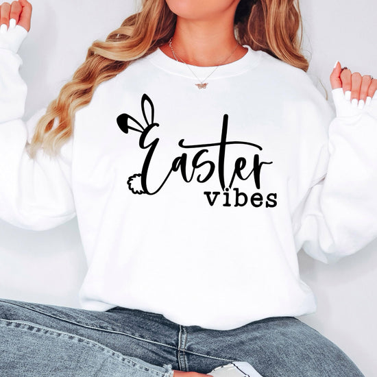 Model wearing Easter Vibes white sweatshirt with Easter bunny print, styled casually