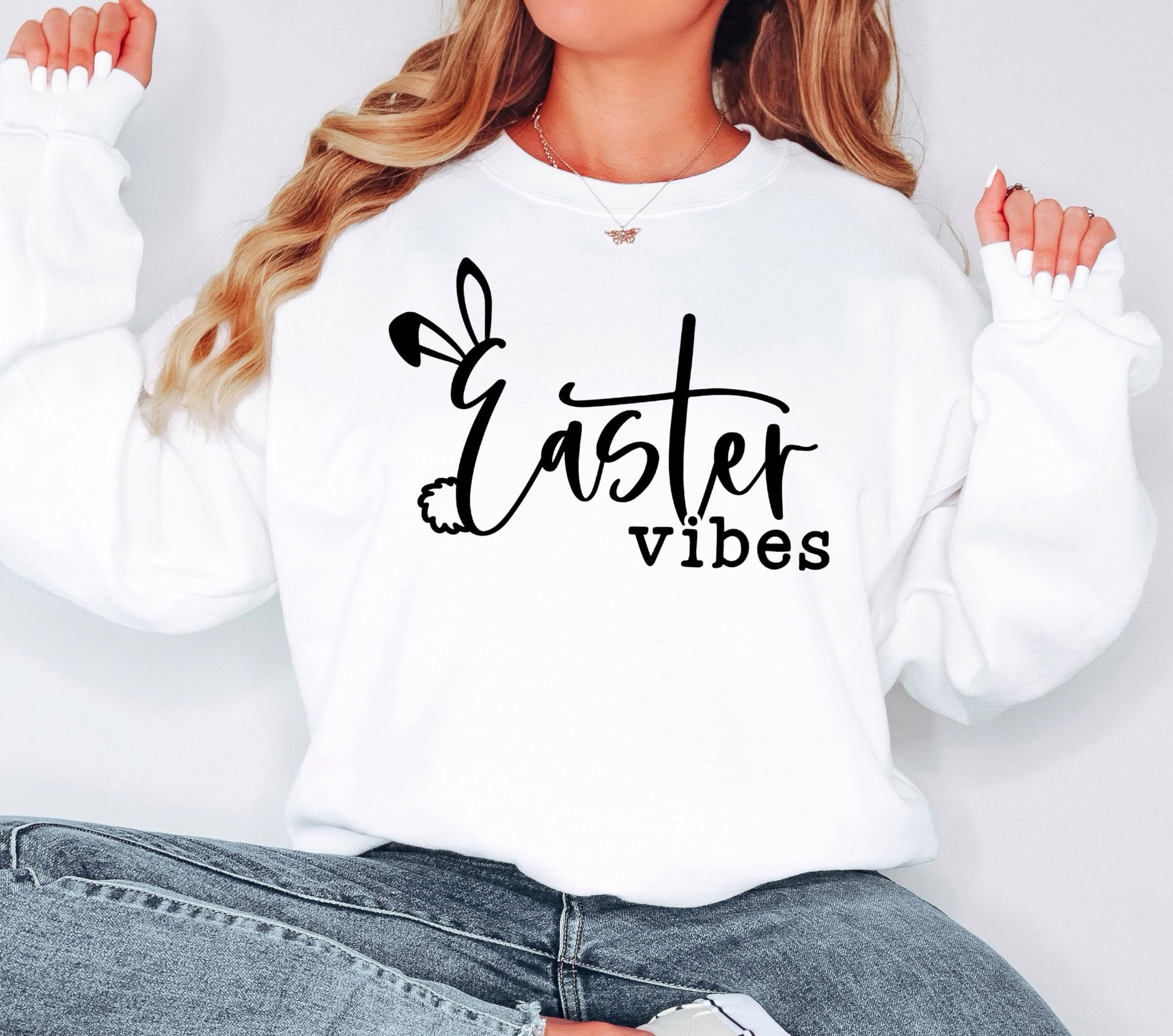Model wearing Easter Vibes white sweatshirt with Easter bunny print, styled casually