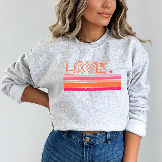 Detail shot of retro Love graphic on cozy gray adult Valentine's Day sweatshirt
