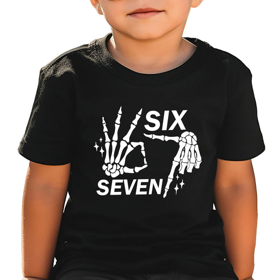 Model wearing six seven skeleton hand Halloween meme tee in casual setting
