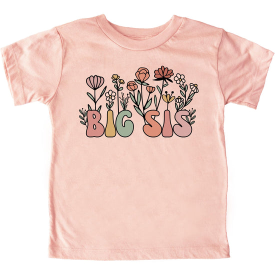 Close-up of floral big sis shirt design with vibrant flowers and bold colorful letters