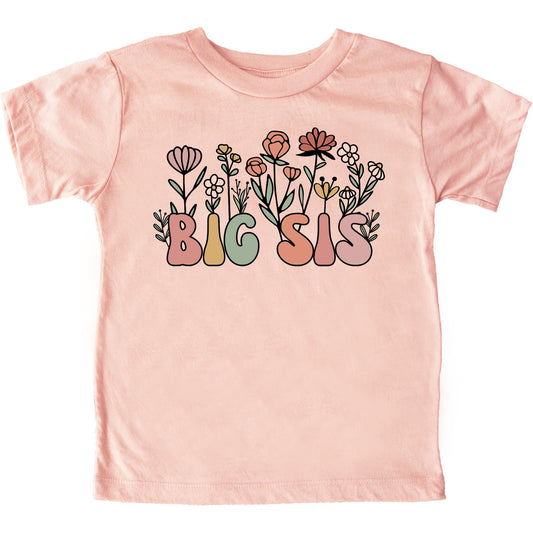 Close-up of floral big sis shirt design with vibrant flowers and bold colorful letters