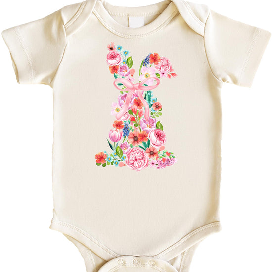 Baby girl wearing a white bodysuit with a watercolor floral Easter bunny and pink bow design