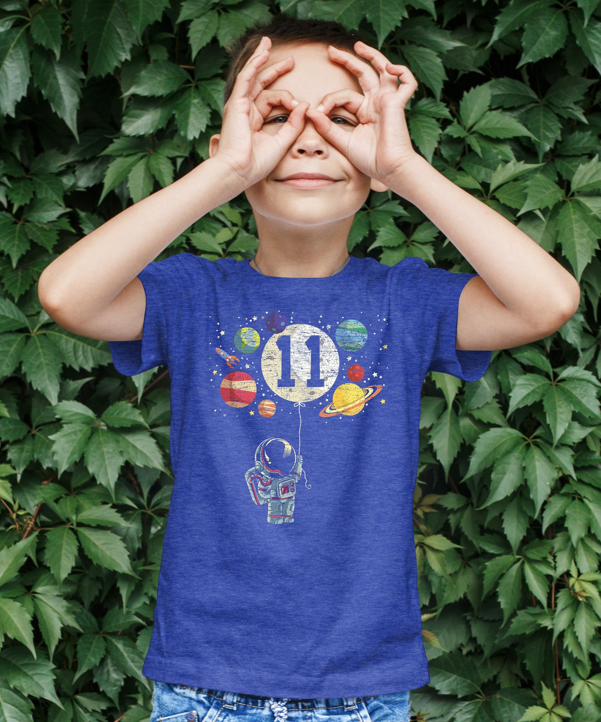 Flat lay of kids 11th birthday astronaut shirt showing full print detail