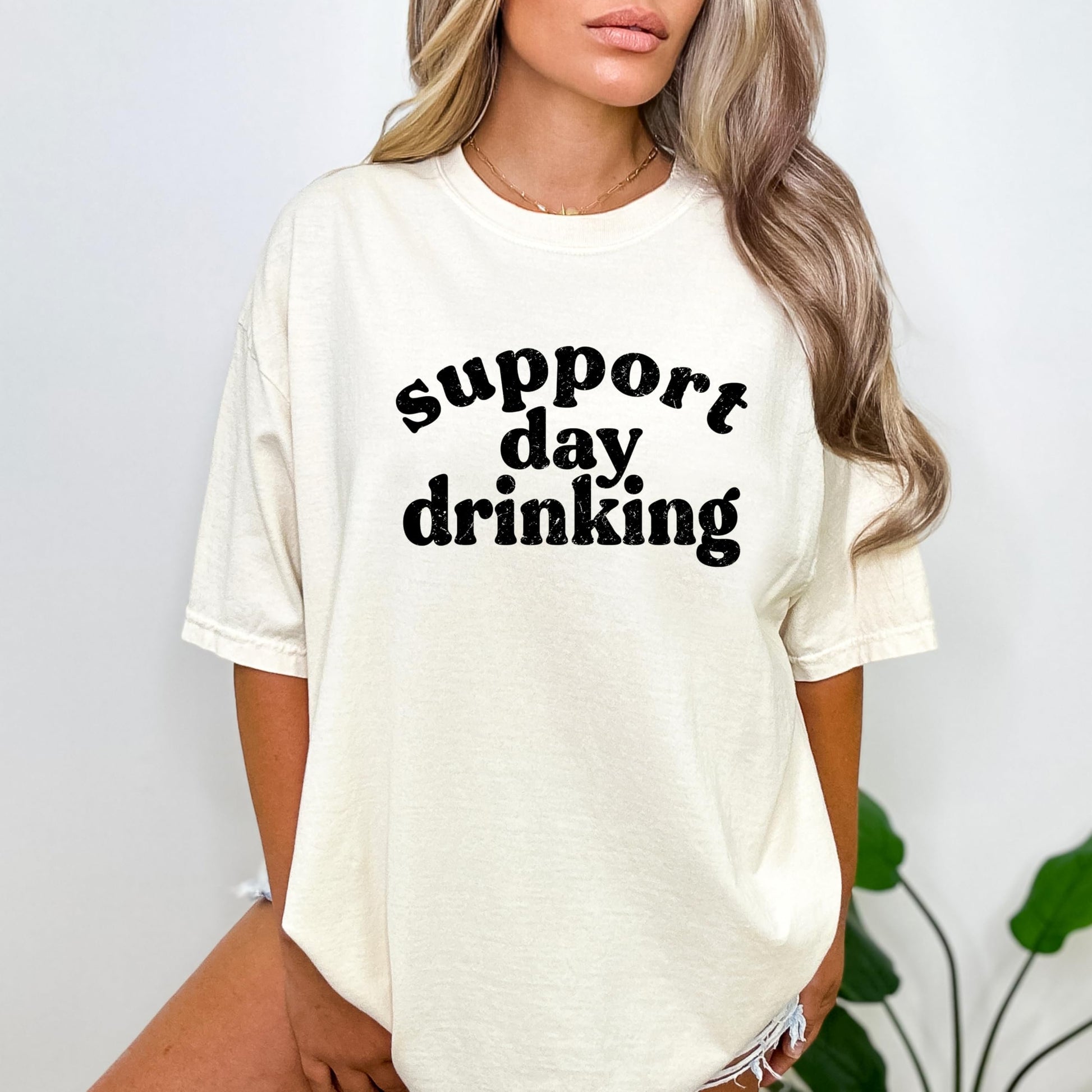 Support Day Drinking t-shirt flat lay showing full design and fit