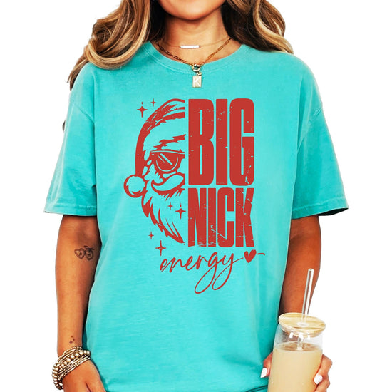Front view of funny Big Nick Energy Santa sunglasses holiday tee on model