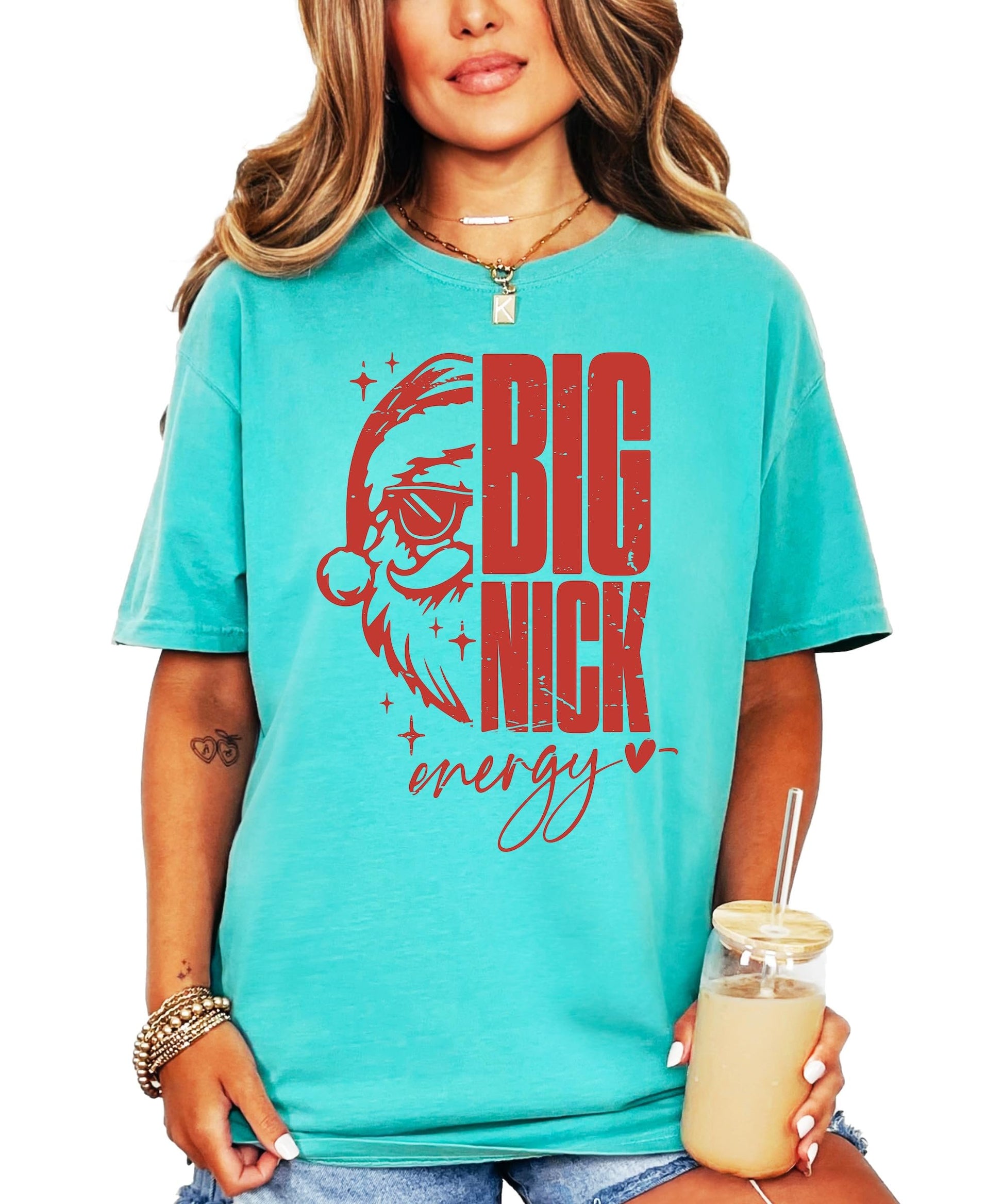 Front view of funny Big Nick Energy Santa sunglasses holiday tee on model