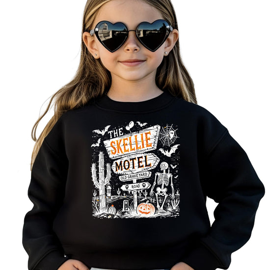 Olive Loves Apple The Skellie Hotel Halloween crewneck sweatshirt with spooky skeleton and pumpkin graphic design