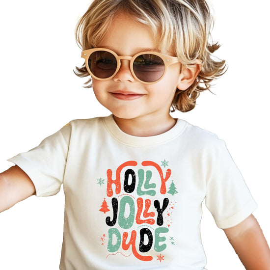 Close-up of Holly Jolly Dude retro Christmas graphic print on natural boys' tee
