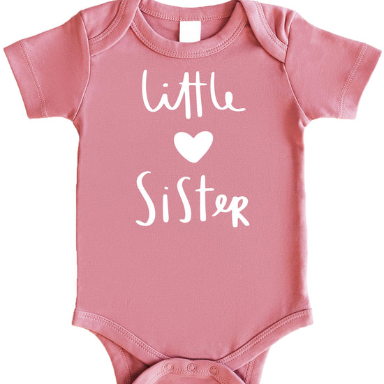 Little Sister heart bodysuit styled for a sibling reveal or pregnancy announcement photo