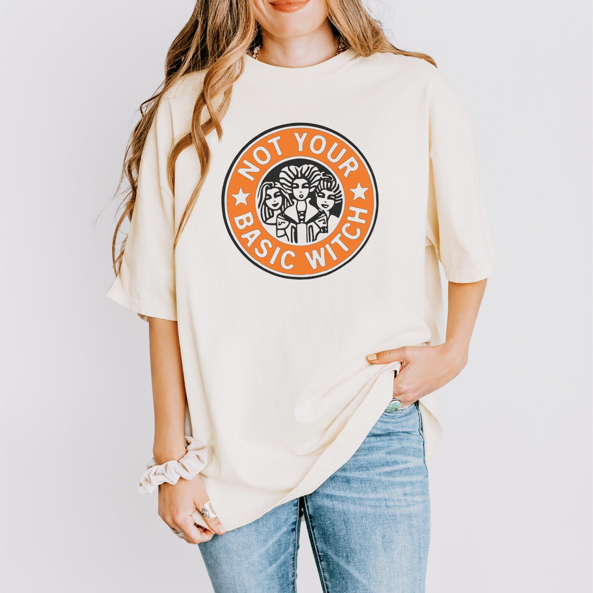 Lifestyle flat lay of Not Your Basic Witch women's ivory Halloween graphic t-shirt