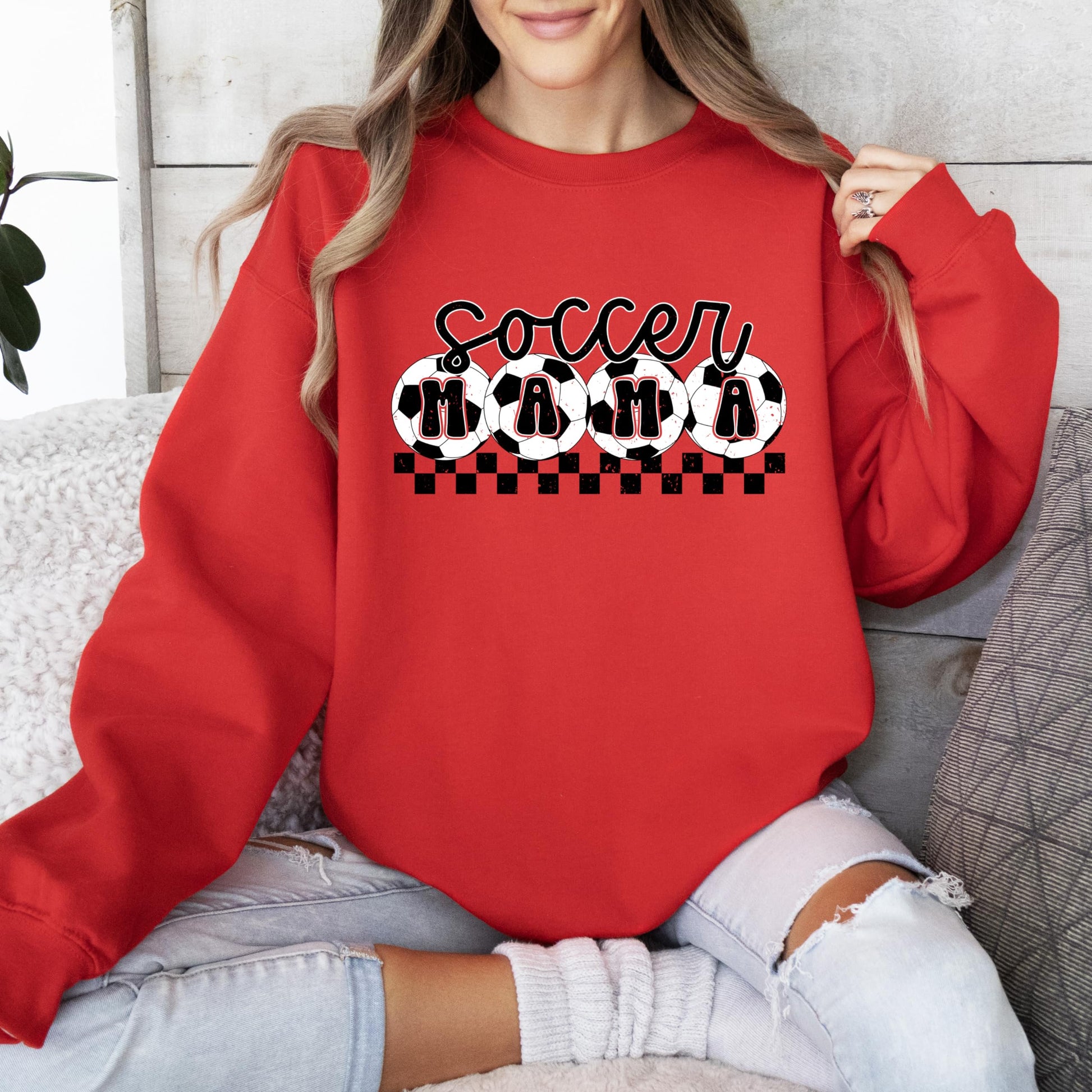 Olive Loves Apple Soccer Mama sweatshirt detail showing bold graphic print and fabric texture