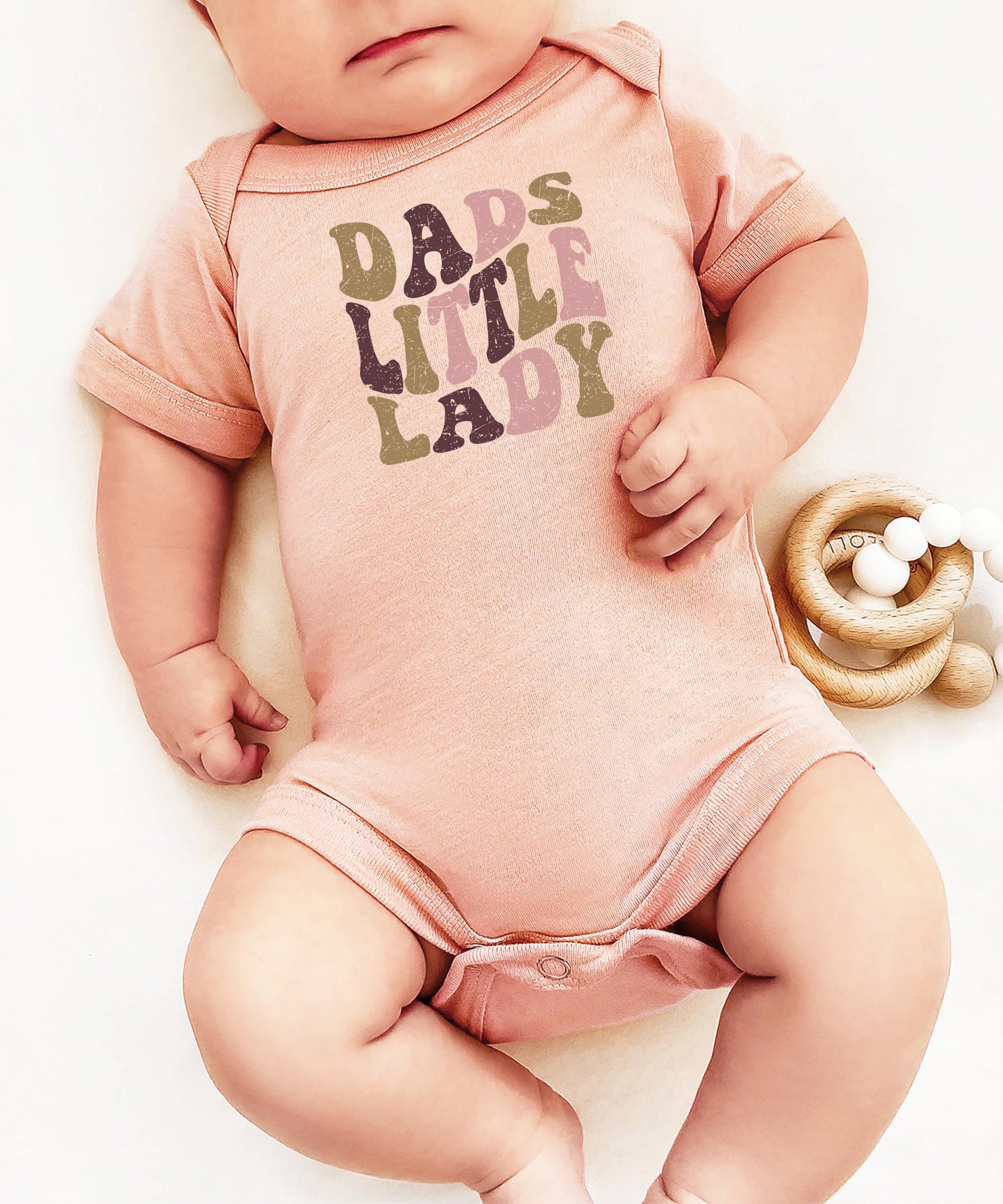 Dad's Little Lady newborn bodysuit displayed as a Father's Day or baby shower gift