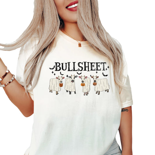 Close-up of Bull Sheet ghost cow Halloween graphic print on seafoam tee
