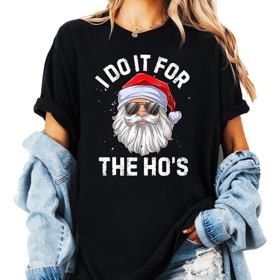 Flat lay of unisex vintage green Christmas graphic tee with humorous holiday print