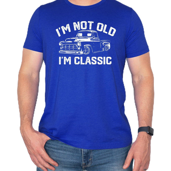 Front view of men's black funny dad joke shirt with retro truck graphic design