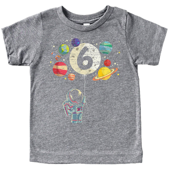 Front view of youth space themed 6th birthday shirt with rocket and planet design