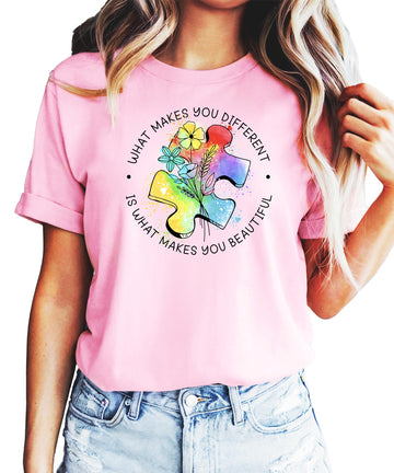 Pink autism awareness t-shirt with colorful watercolor puzzle pieces and What Makes You Different text