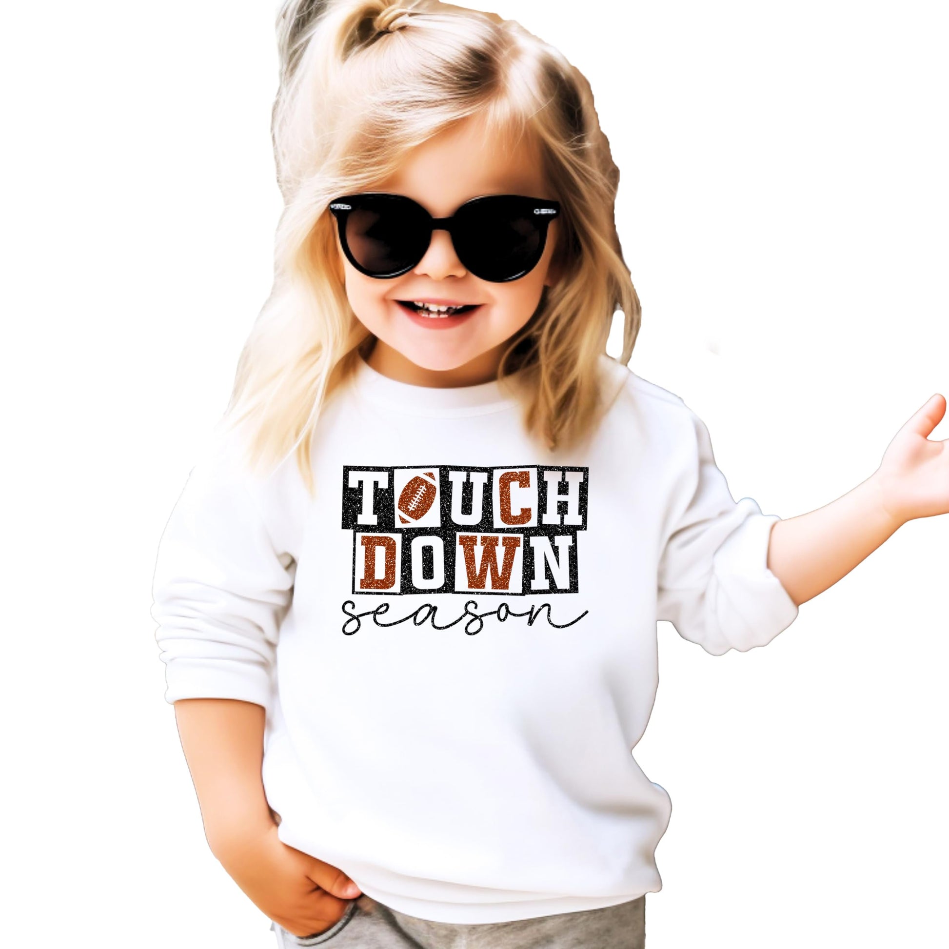 Close-up of faux glitter touchdown season graphic on grey women's sweatshirt