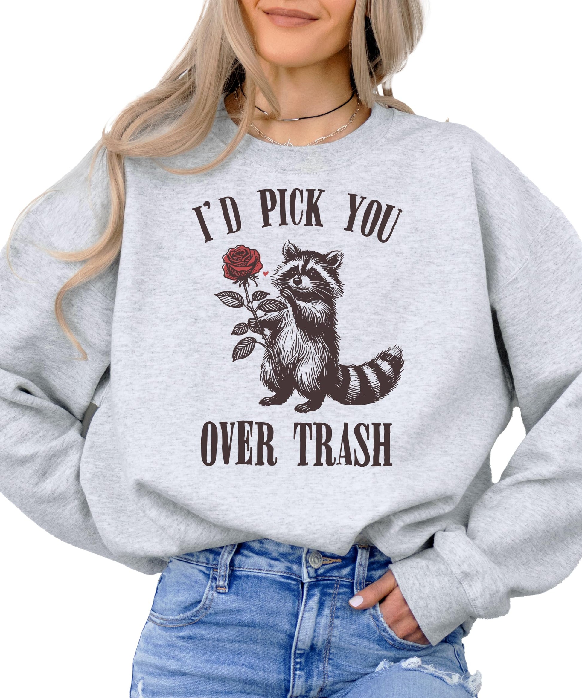 Close-up of raccoon Valentine's Day graphic print on white sweatshirt showing print detail and quality