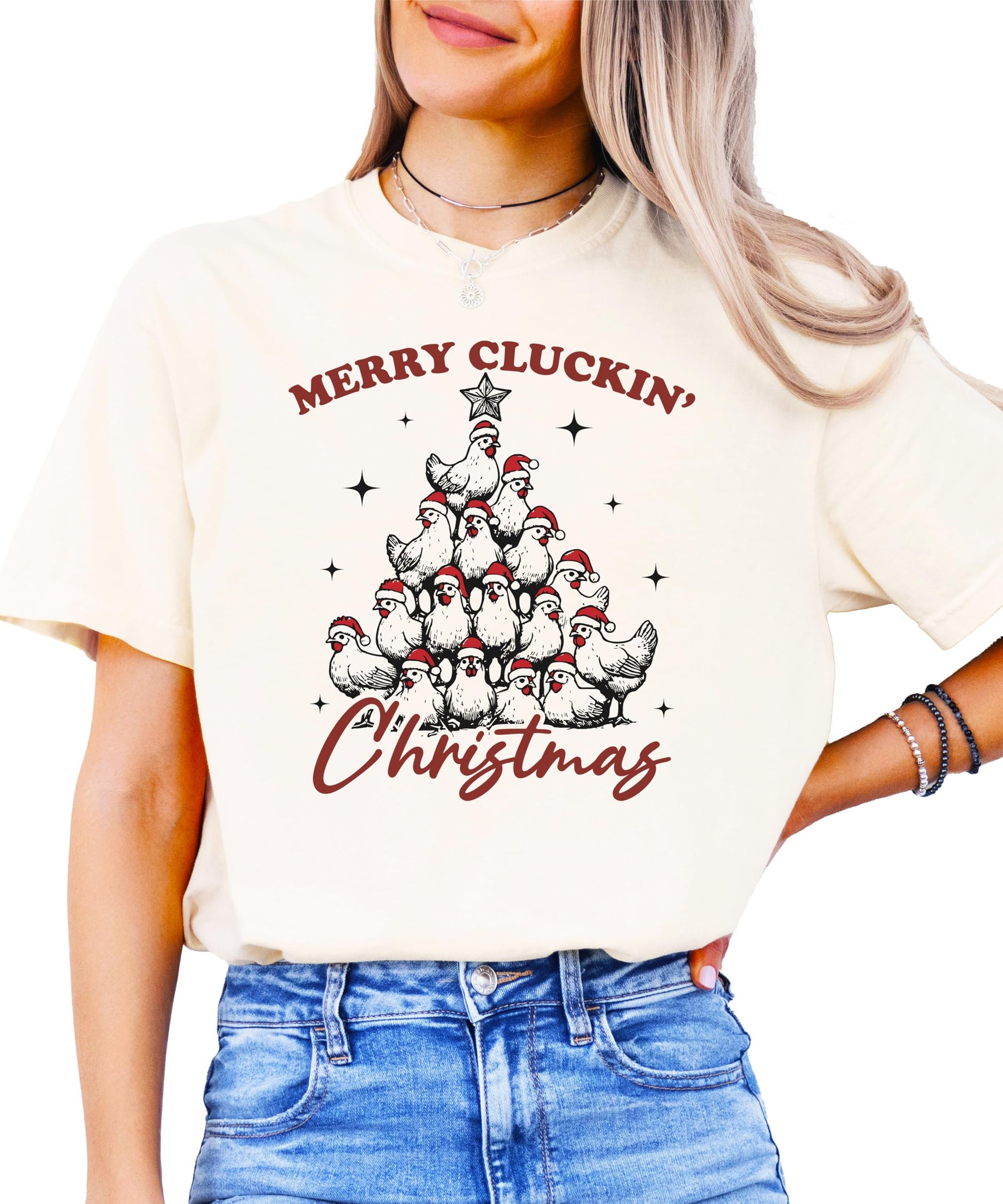 Close-up of Merry Cluckin' Christmas chicken holiday graphic on seafoam shirt