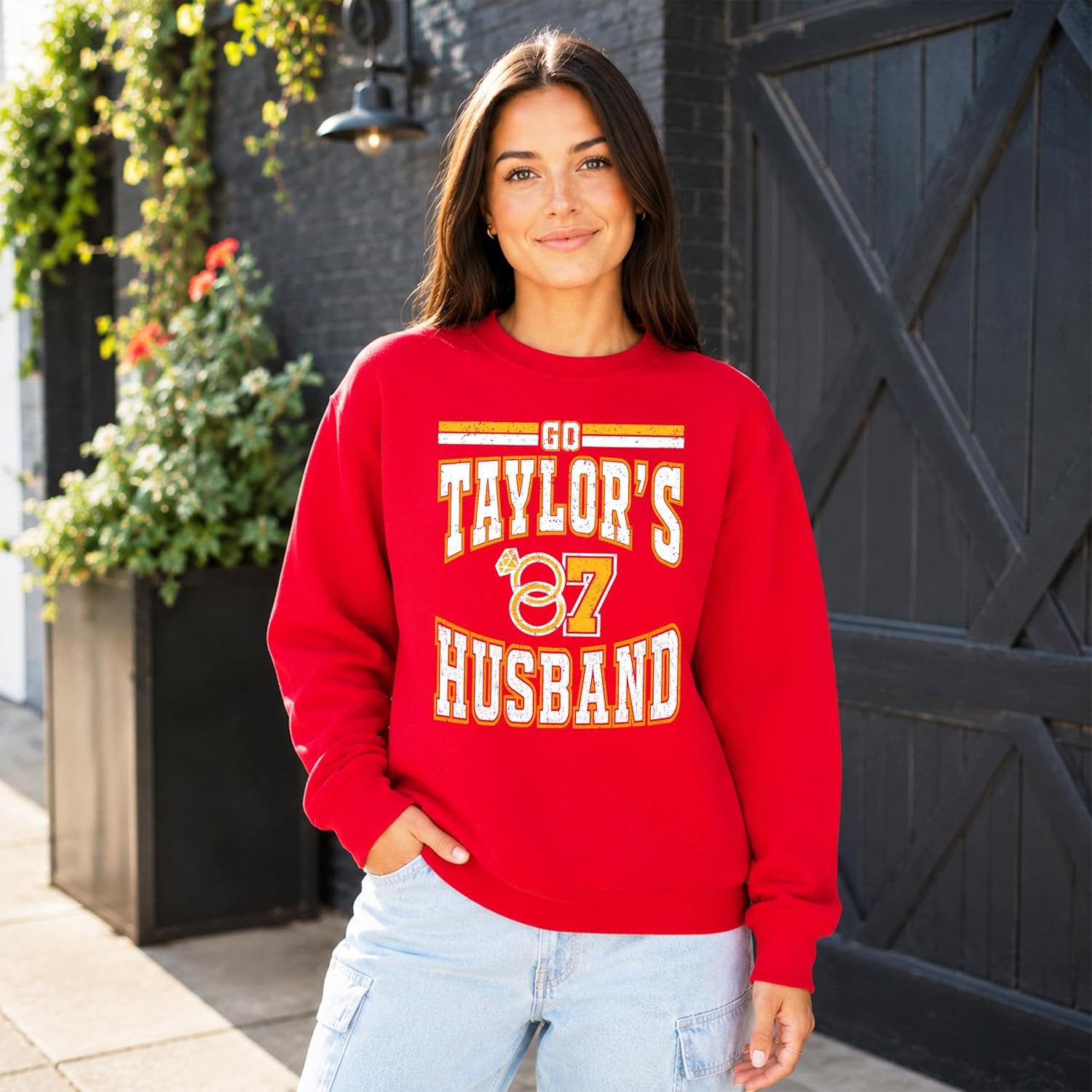Flat lay of red brushed-fleece Go Taylor's Husband pullover sweatshirt with ribbed cuffs and hem