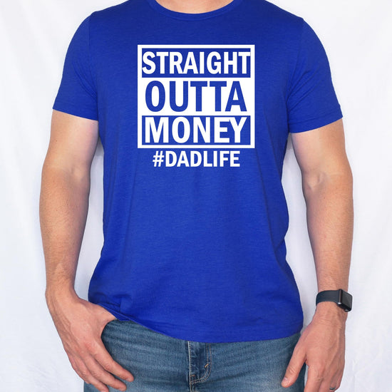 Side angle view of royal blue dad life t-shirt with Straight Outta Money design