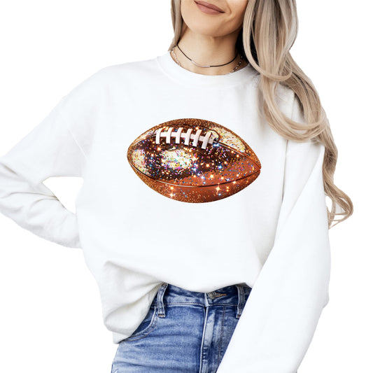 Close-up of glitter football design on women's white sweatshirt