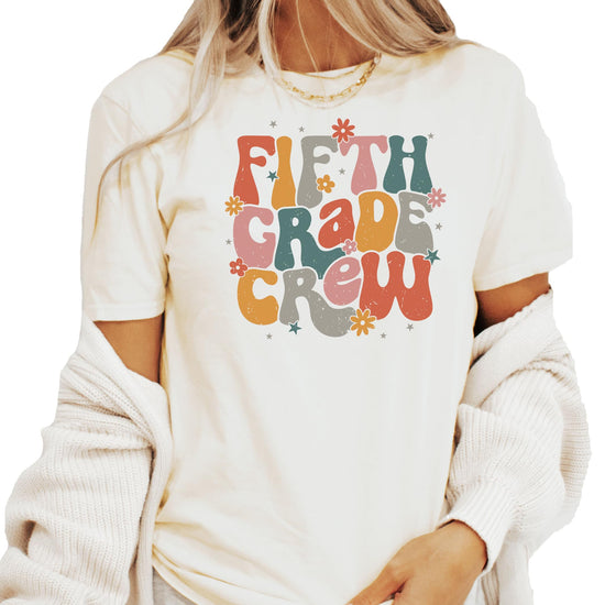 Close-up of second grade vintage text design on peach colored t-shirt