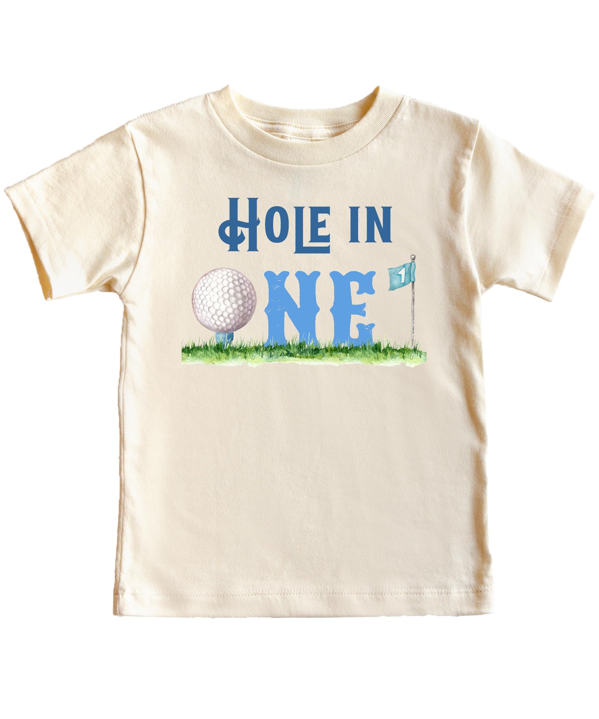 Flat lay of boys first birthday golf shirt showing full Hole in One graphic design on natural tee