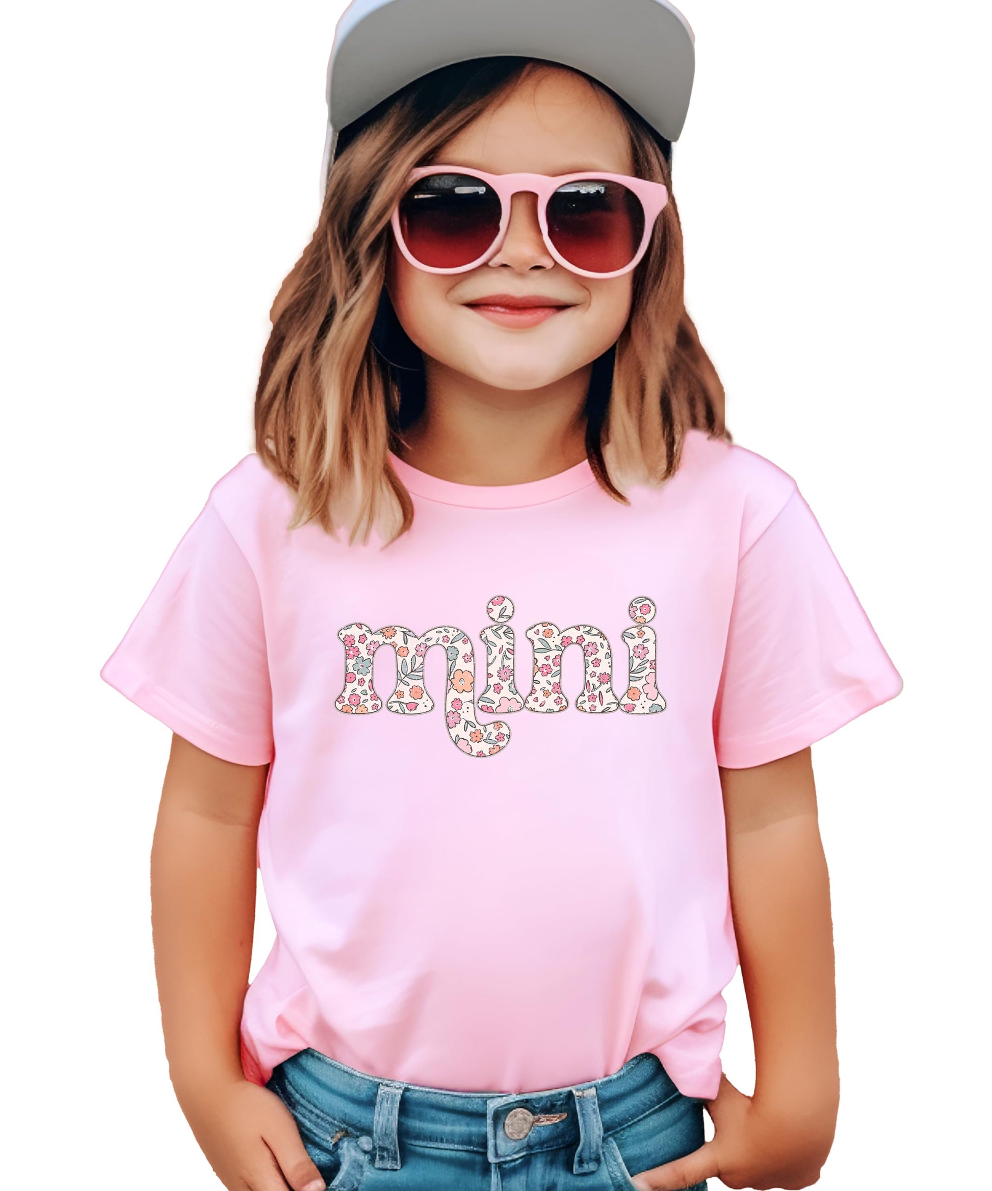 Close-up of retro floral font graphic print on pink mama and mini matching tee