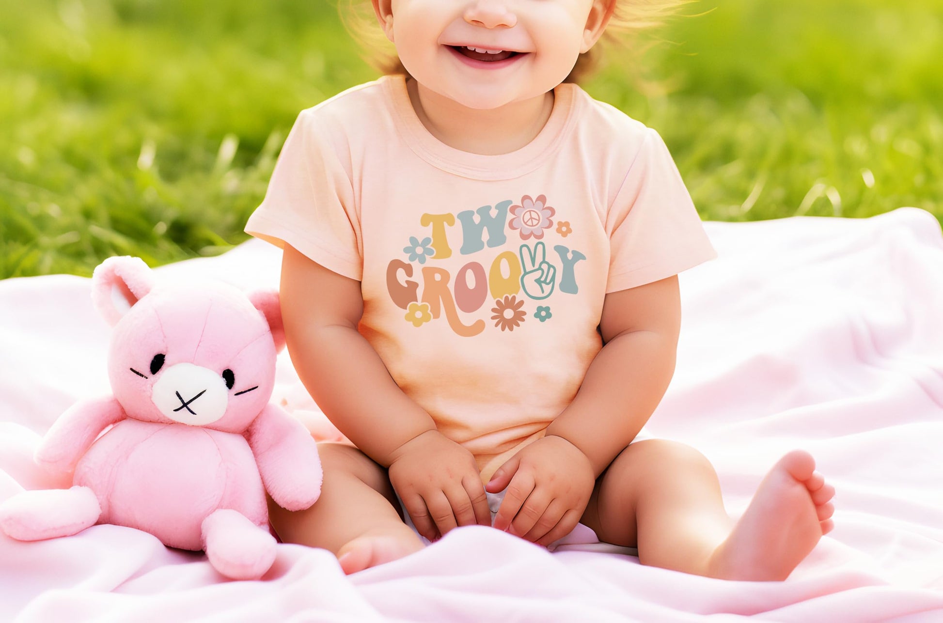 Side view of toddler wearing Two Groovy daisy birthday shirt showing comfortable fit