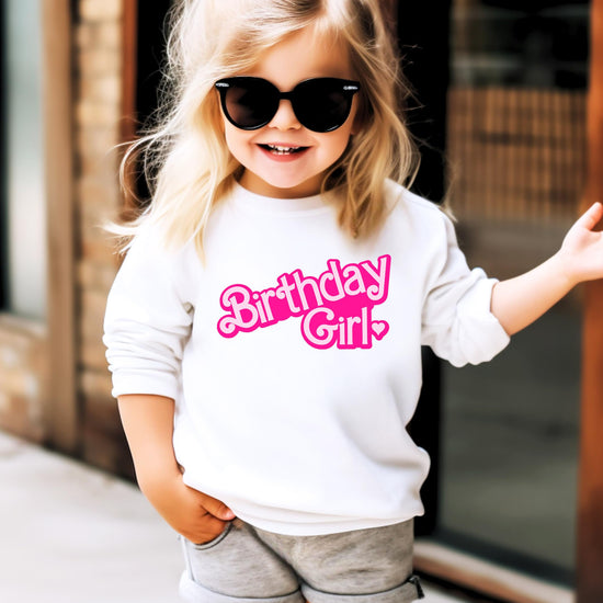 Side or detail view of pink Birthday Girl sweatshirt for toddler and youth sizes